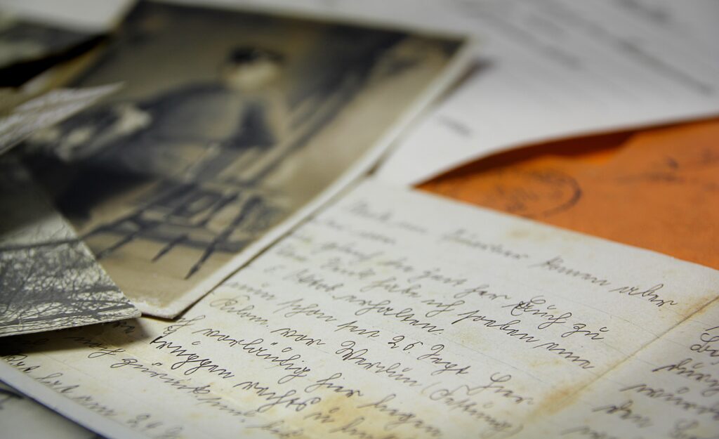 photos and mail with writing on it
